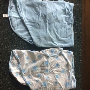 TWO Miracle Blanket swaddles